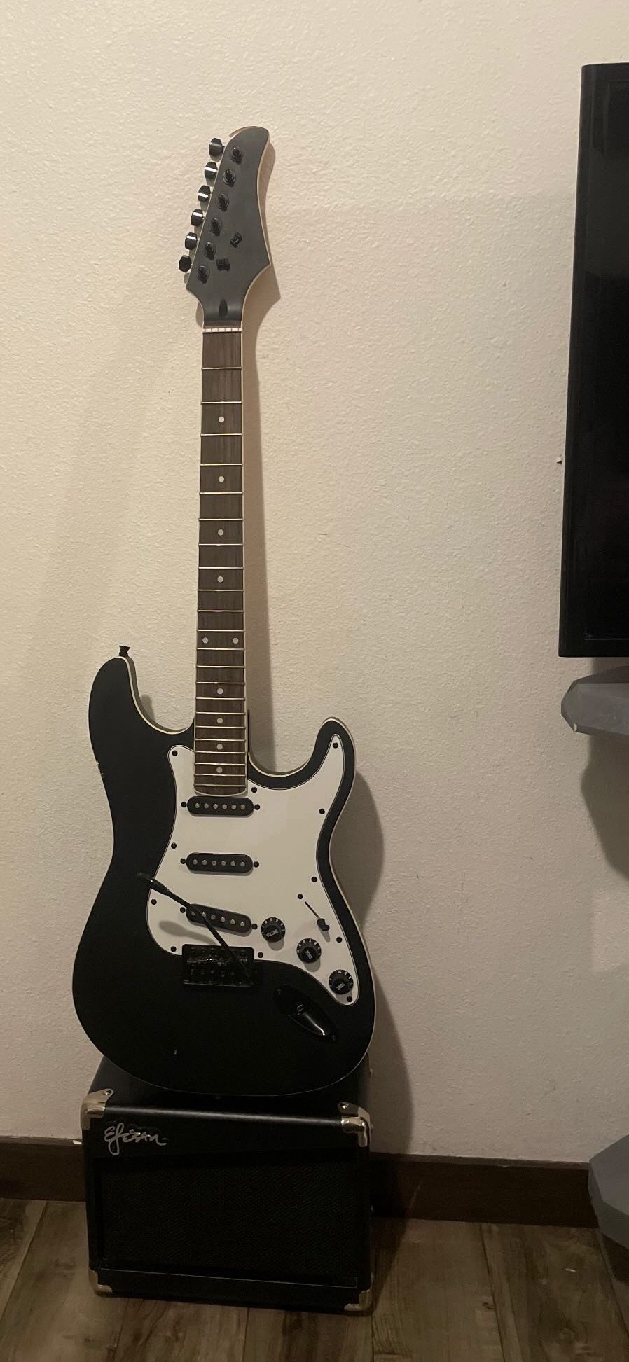 electric guitar with amp
