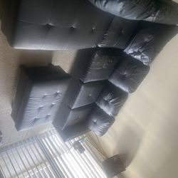 Black sectional with Ottoman