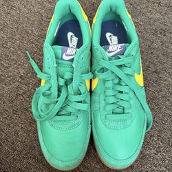 Green and yellow Nikes  size 11