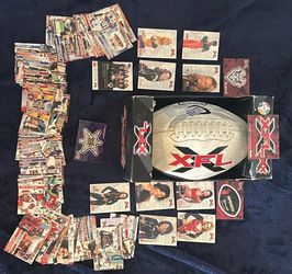 XFL football with a large collection of XFL trading cards and inserts. Includes players and teams from the original XFL, plus cheerleader cards and ot