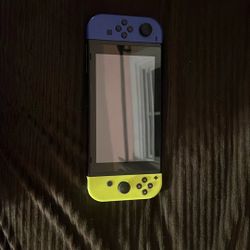 Nintendo Switch With Blue And Yellow Controllers and with 256 GB extra storage And It Comes With A Case And Five Games