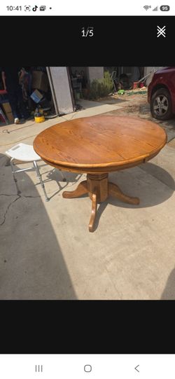 Small wooden round table. Forty two inches across