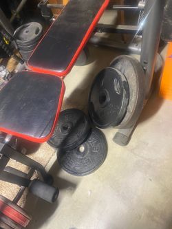 Olympic Weights /Bench with Weight Plates and squat tower two big  Olympic bars and weights everything 300$