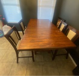 Used dinning room table heavy usage scraps and staines but great if you handy with wood