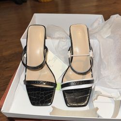 $10-The Drop Avery Square-Toe Two-Strap High Heeled Sandal in a black and white finis