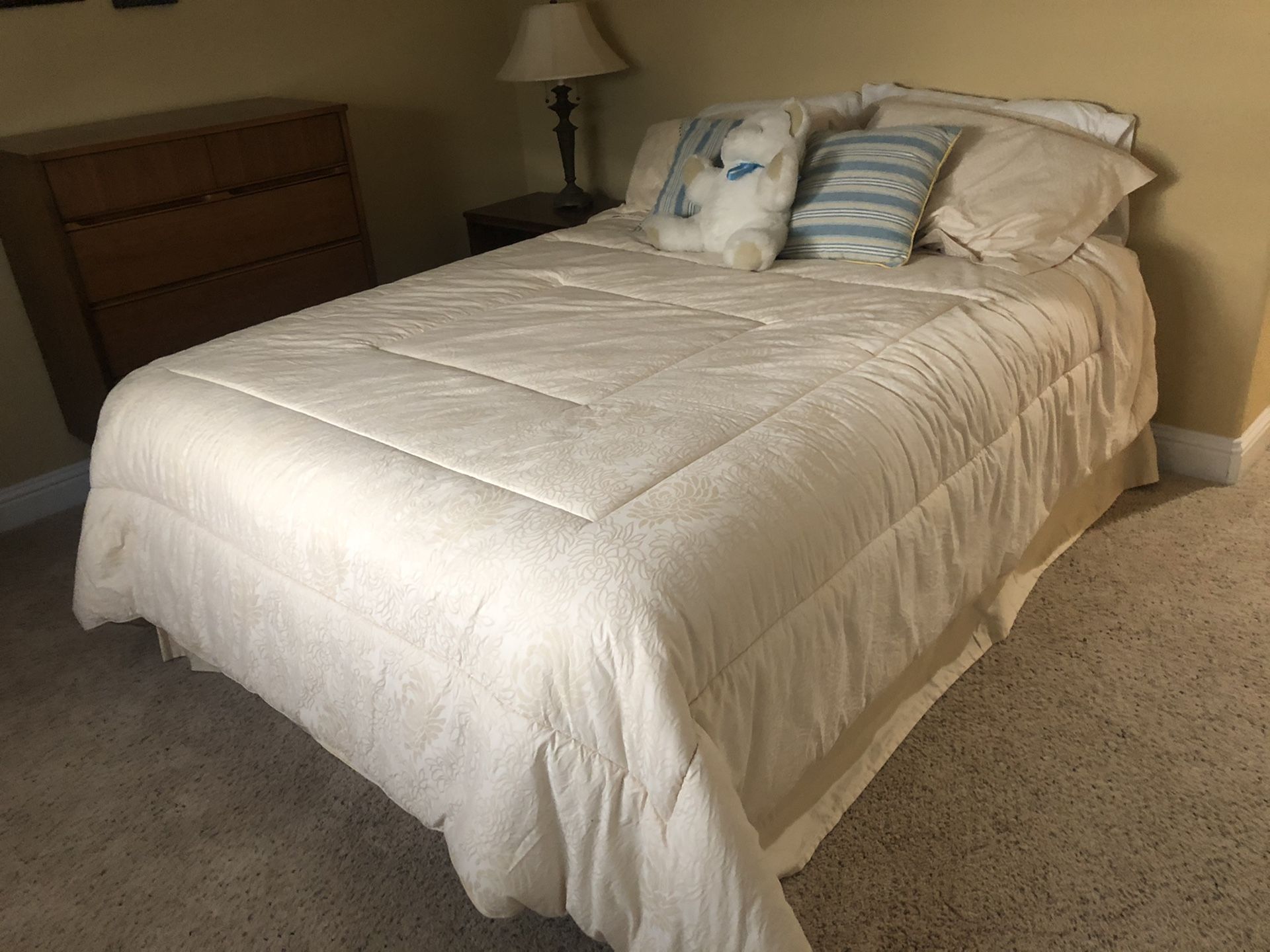 Queen sized bed with pillow top mattress