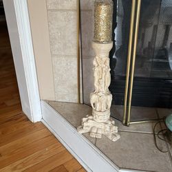 Stand with beautiful candle on top