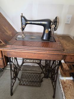 Antique singer sewing machine with base
