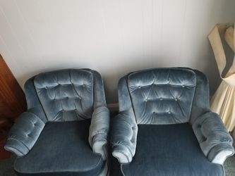 Two Swivel Rocking Chairs