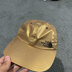 North Face X Supreme gold metallic hat 