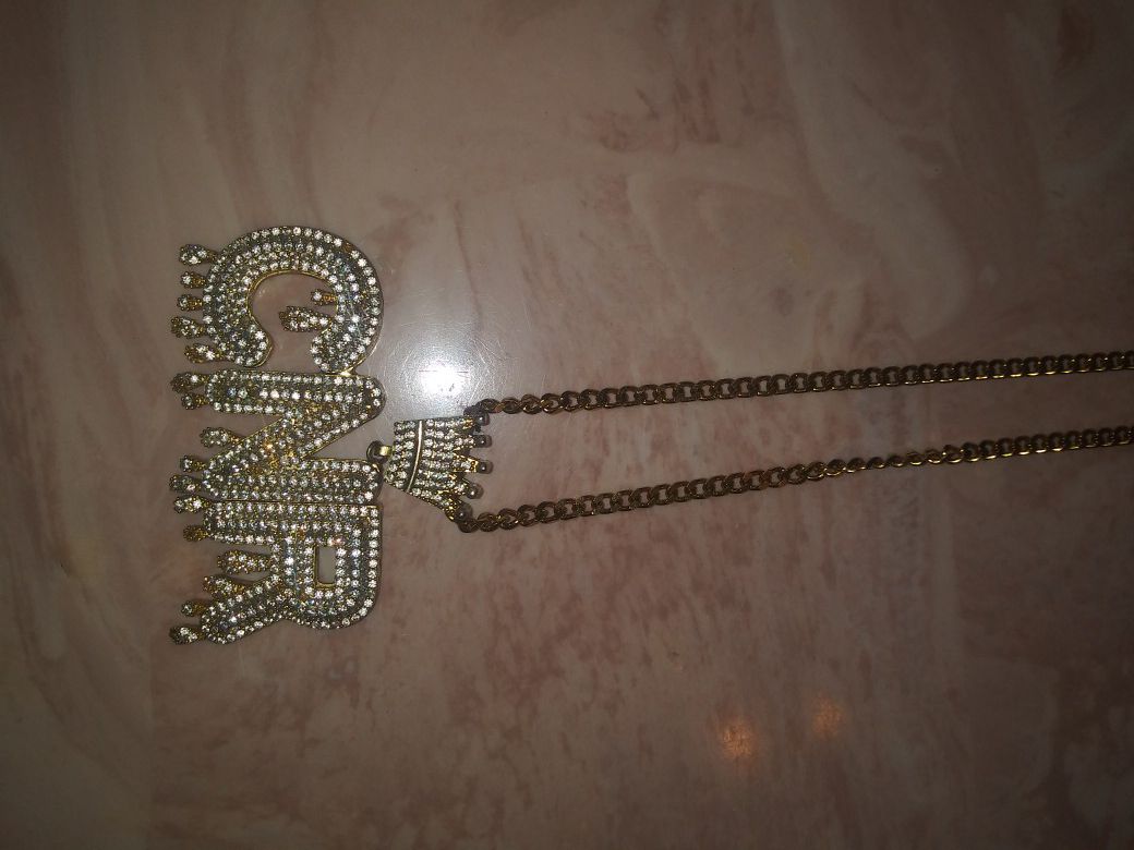 Gold iced out pendant and chain