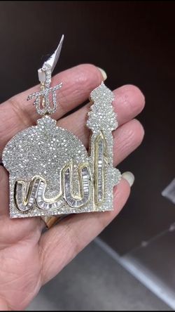 14k gold and 6 ctw round and baguettes diamonds charm.