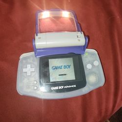 gameboy advance has light and magnifier attachment and case is very rare