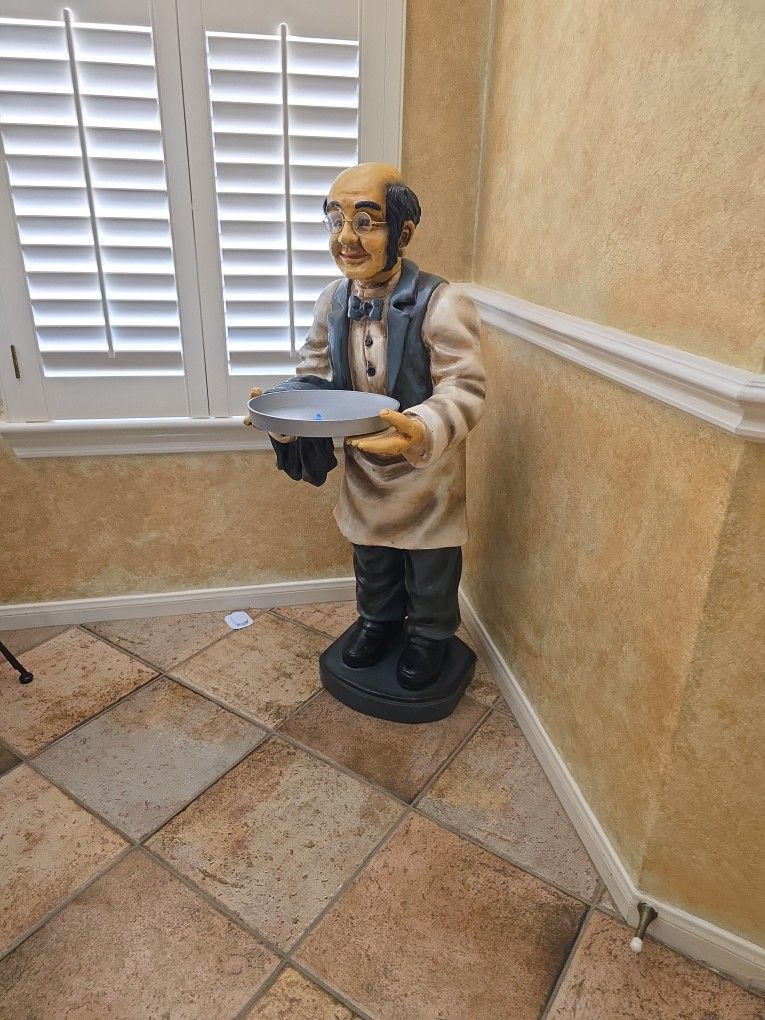 figure of waiter with tray