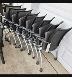 Thirteen fold up office chairs extra seating 6 dollars each!!! Nesting Rolling chairs