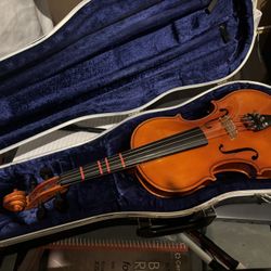 Adult and child violins