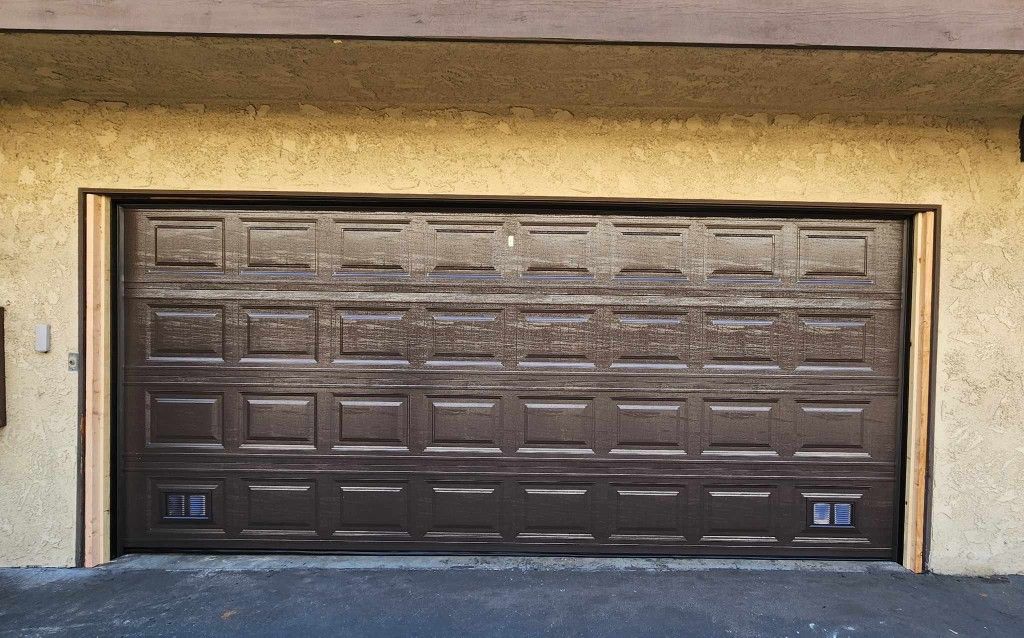 Brown Garage Door With Bottom Vents