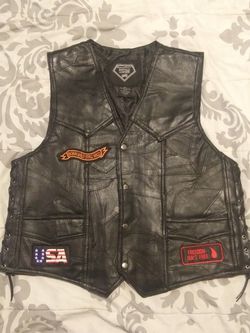Brand new motorcycle jacket and vest (both large)