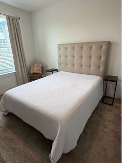 Queen bed with upholstered headboard