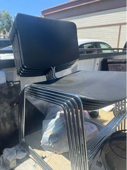 Steelcase Max-Stacker black upholstered stacking chairs with a chrome frame