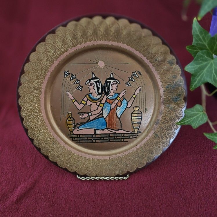 "Legacy of the Nile: Egyptian Sisters Brass Plate – A Timeless Echo of Ancient Beauty"