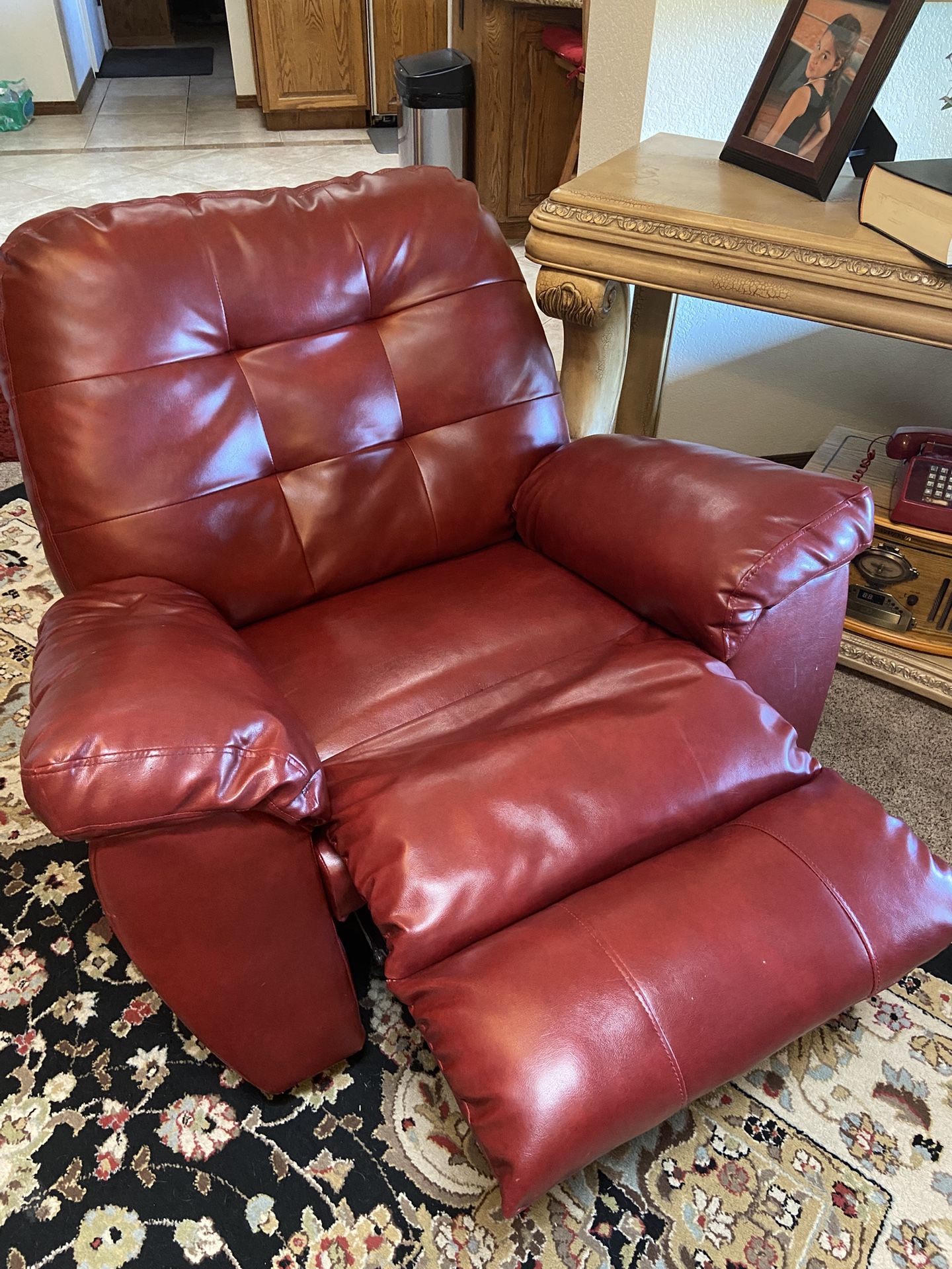 Red leather couch, chair, and loveseat