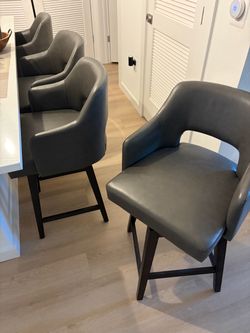 4 Bar Counter Leather Swivel chairs.