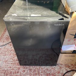 Insignia Mini refrigerator. model number NS-CF26BK6.