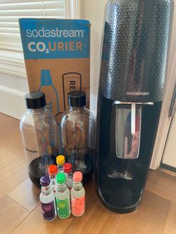 Sodastream with two bottles, 3 full canisters  and 6 flavors