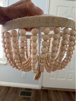 Three light beaded light fixture.