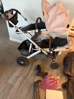 Fully loaded uppa baby vista double stroller with bassinet