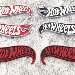 Set Of 2 Metal Hot Wheels Badges approximately 3.5".  Adhesive Back. Sign Sold Separately $70.  SHIPPING IS AVAILABLE 