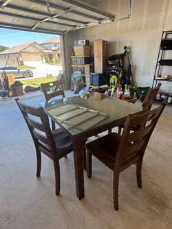 Dining set with a tempered glass top