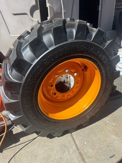 Skid steer wheel