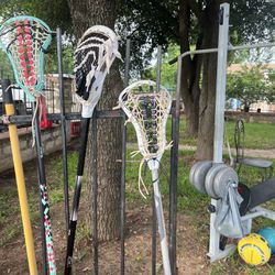 3 Lacrosse Sticks And Teo Soccer Balls