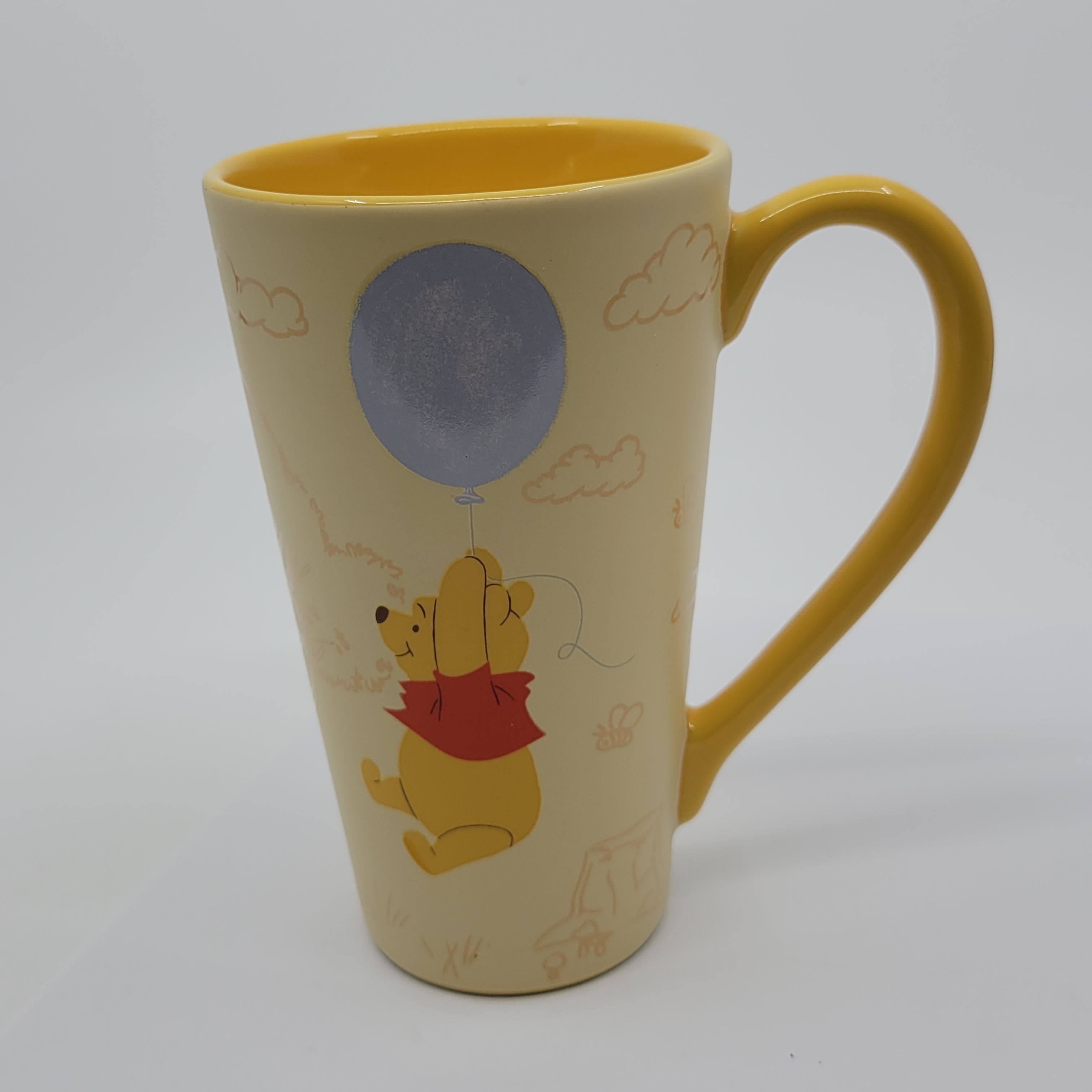 Disney Store Winnie the Pooh Tall Coffee Mug Cup 6 Inches Tall - Pooh & Balloon. Pre-owned, good shape - chips or cracks.