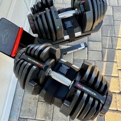 Pair Of Bowflex 1090 Adjustable Dumbbells With Media Stand