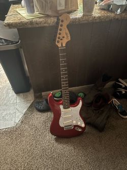 Red Electric Guitar Fender Squier
