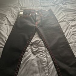 Black True Religions With Red Stitching