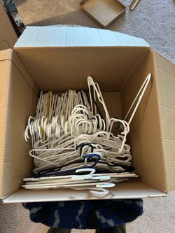 Box of plastic clothes hangers
