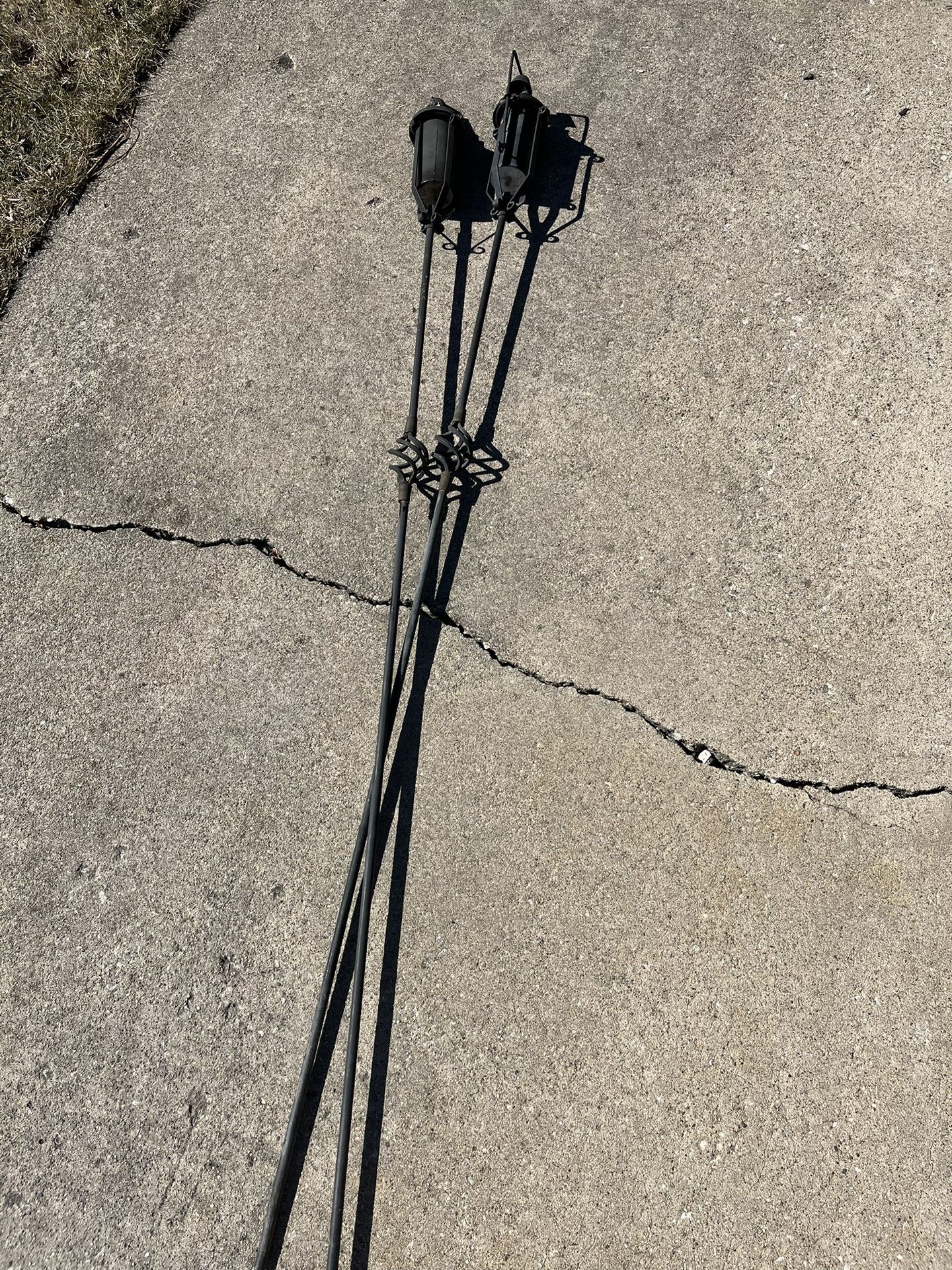 Two rare metal tiki torches