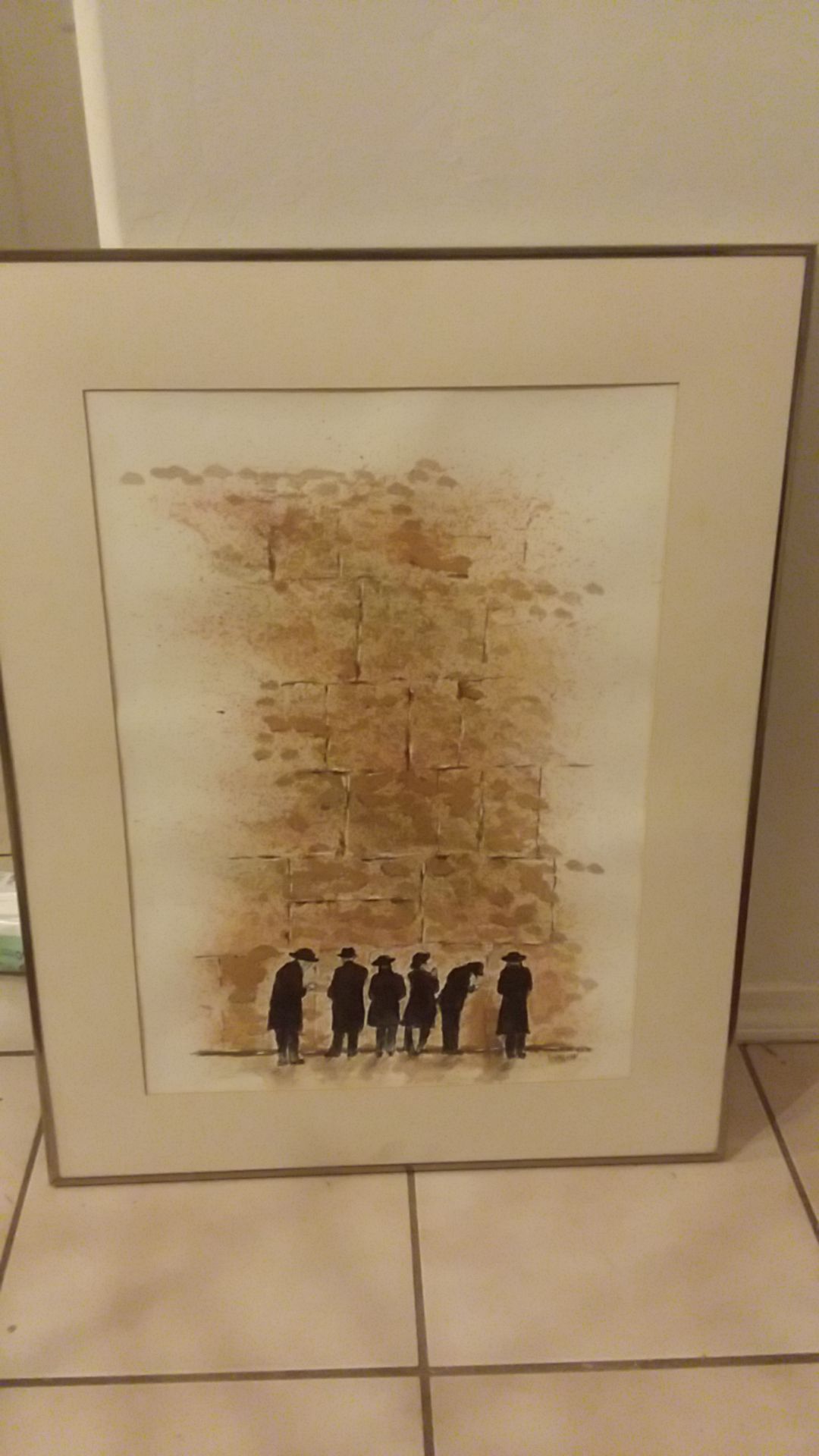 5 Jewish priest looking at a famous wall