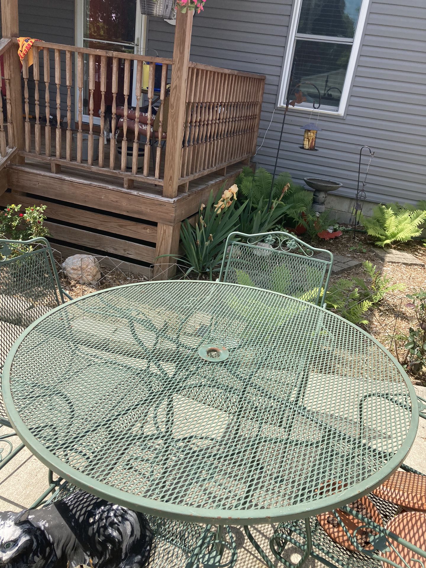 Large 48” Diameter - Round Wrought Iron Table and 4 Chairs. Extremely Nice Set.  $215. OBO