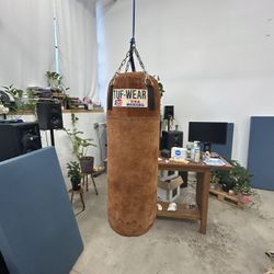 Two Vintage Heavy Punching Bags