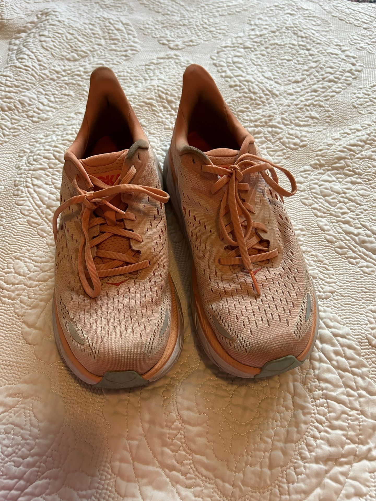 Orange HOKA size woman’s 9.5