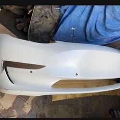 Tesla 3 Front Bumper 17/to/23 W/Sensors Factory Oem has dent 