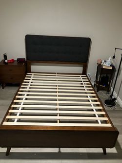 Queen sized bed frame with tufted headboard