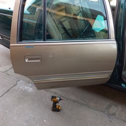 97 Cadi Deville Pass.rear Door . Read Description