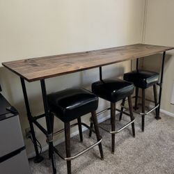 Industrial Bartop Table And Black Stools