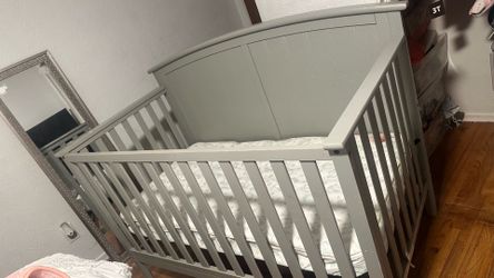 Used Convertible 4-1 crib in grey color needs paint job. In good condition with mattress.